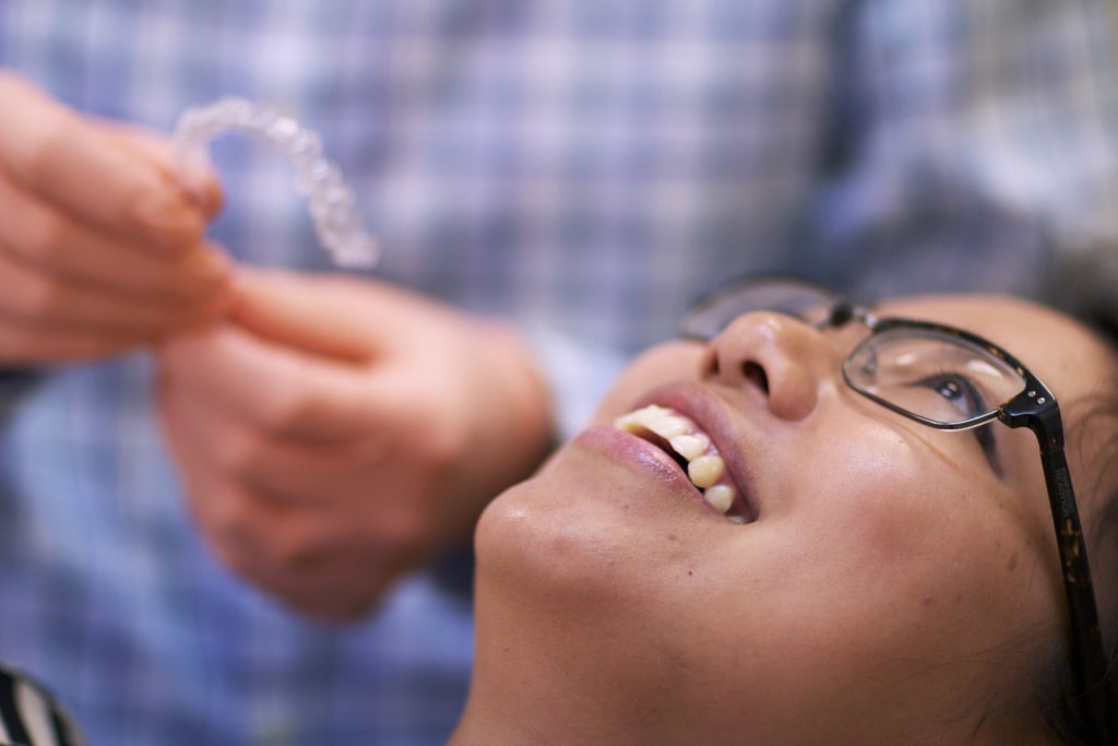 A patient of Clayton Orthodontics waits for clear aligners.