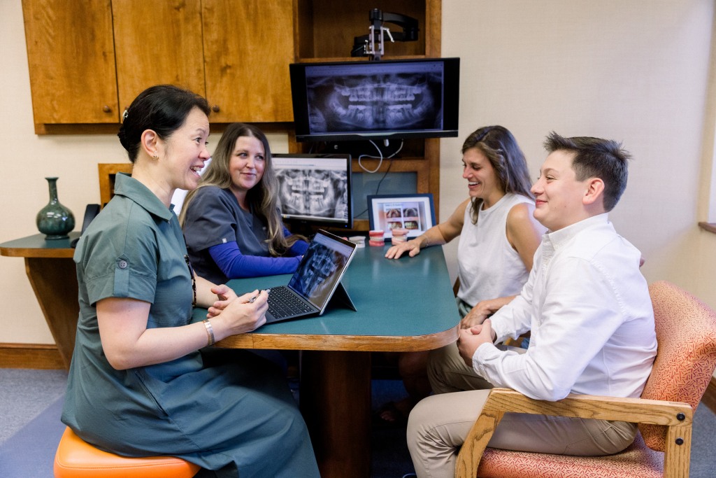 Dr. Diane consults with a young patient and his mother.
