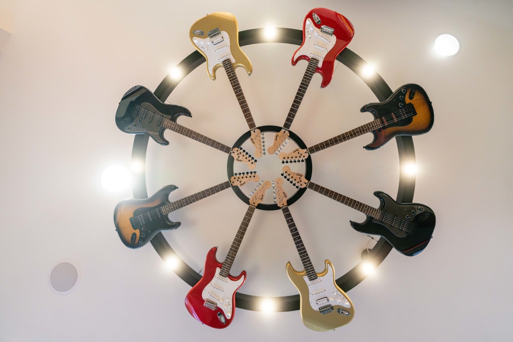 A ceiling fan made of guitars at Sturbridge Orthodontics.