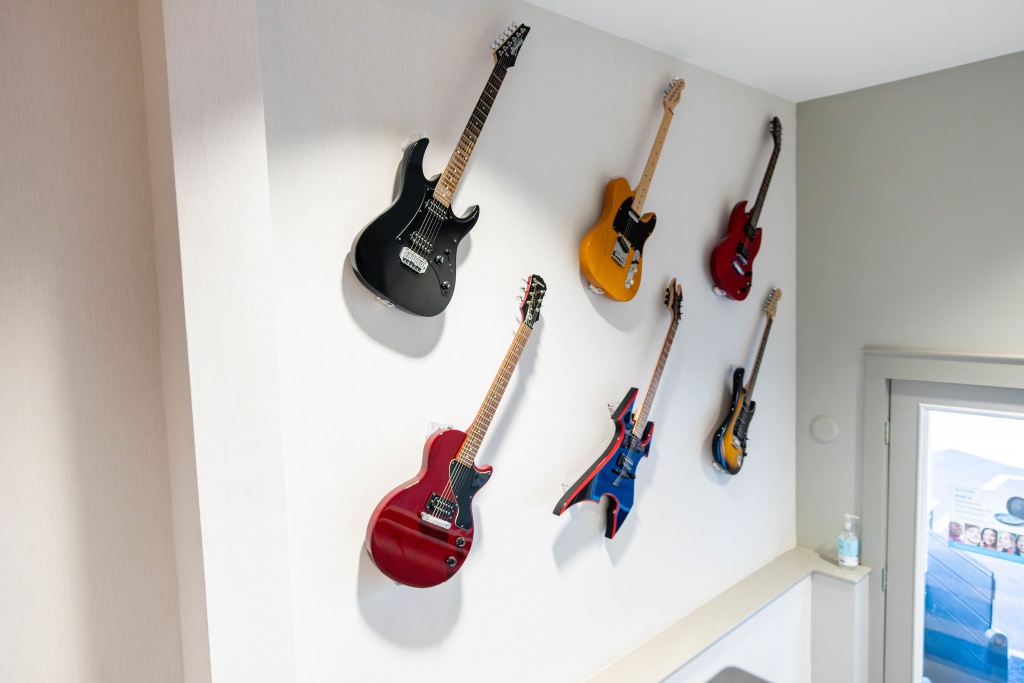 Guitars on the wall at Sturbridge Orthodontics.