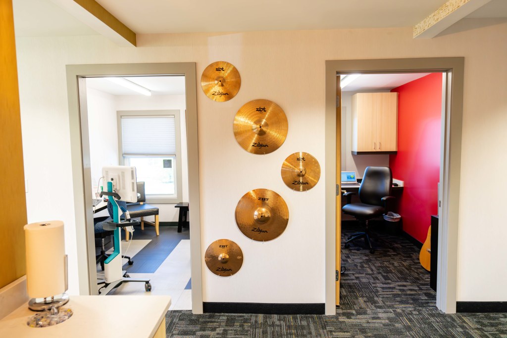 Cymbals on the wall at Sturbridge Orthodontics.