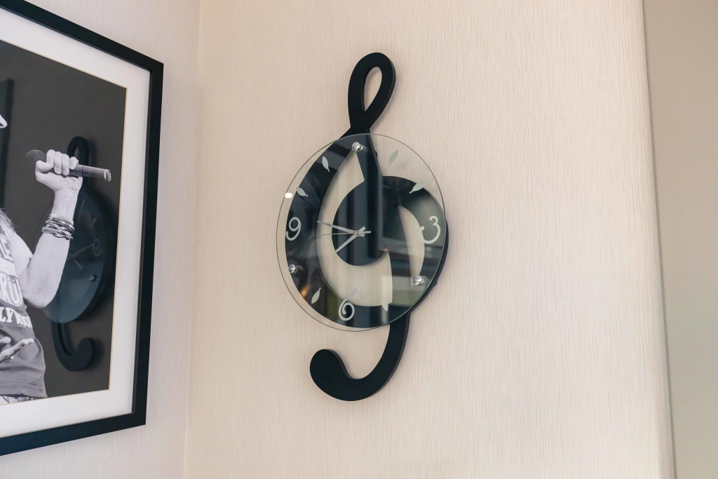 A treble clef clock on the wall at Sturbridge Orthodontics.