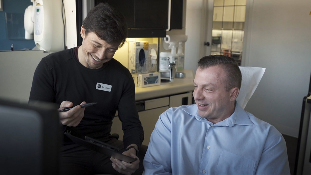 Dr. Girard Chatting With a Patient