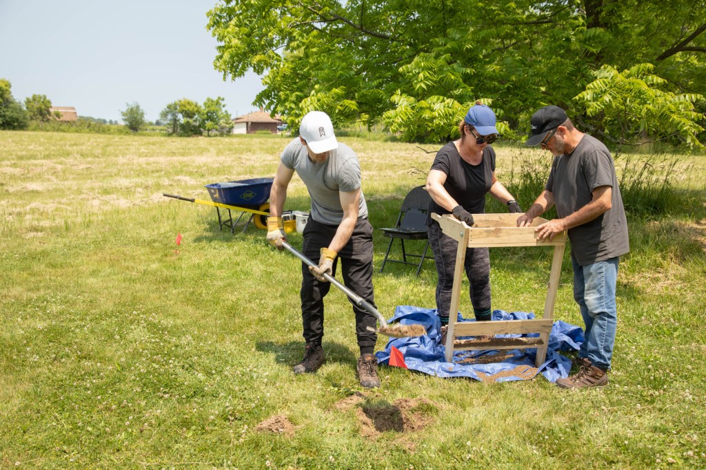 People are digging up dirt to be sifted.