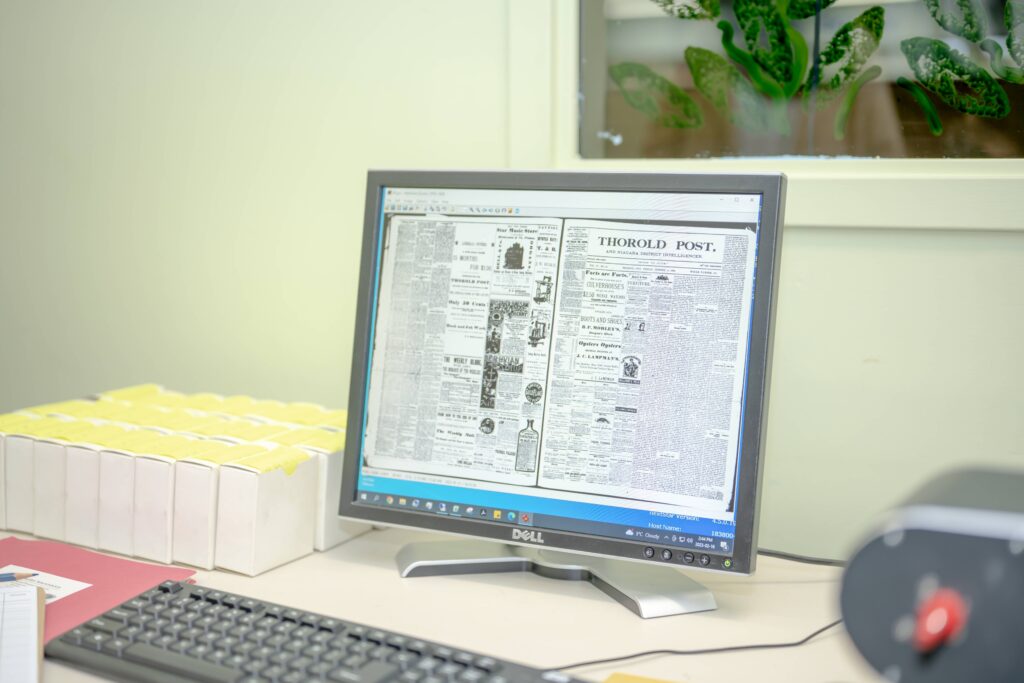 Computer displaying digitized version of 'Thorold Post'