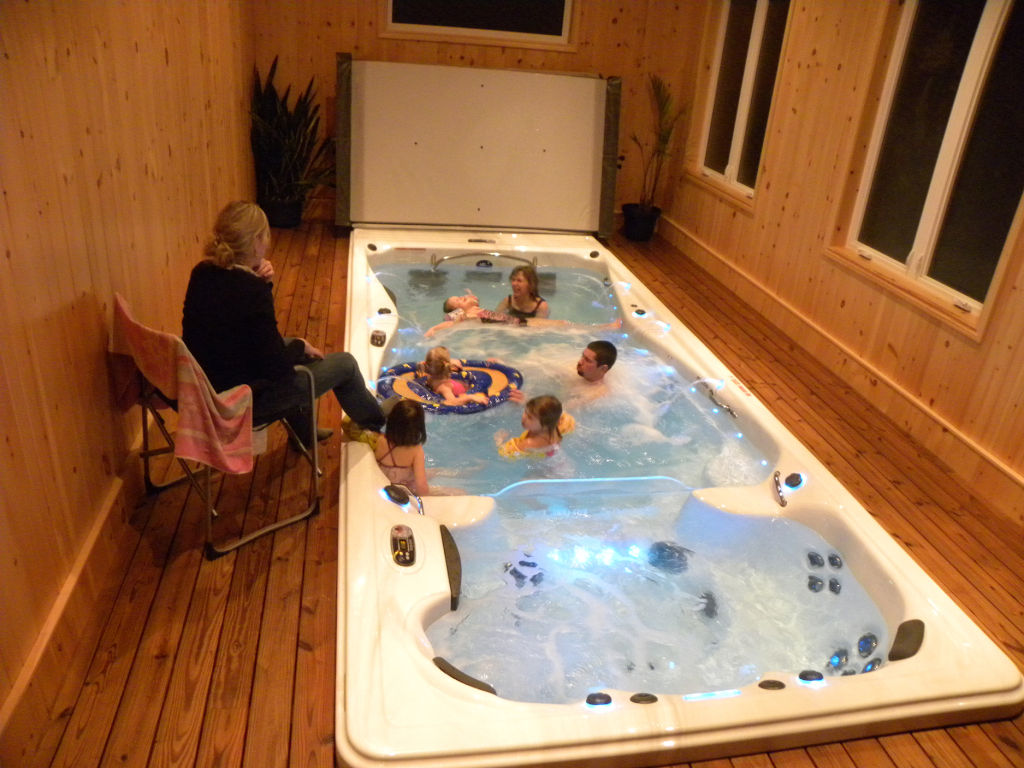 Family enjoying time in a swim spa