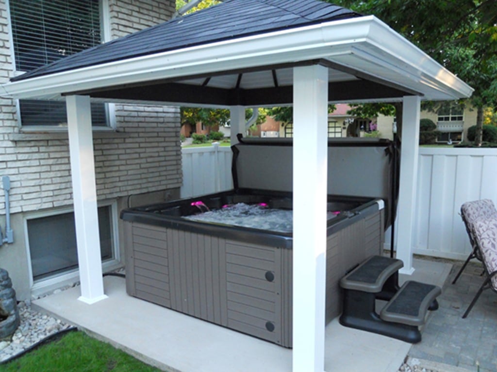 Outdoor spa under a gazebo	