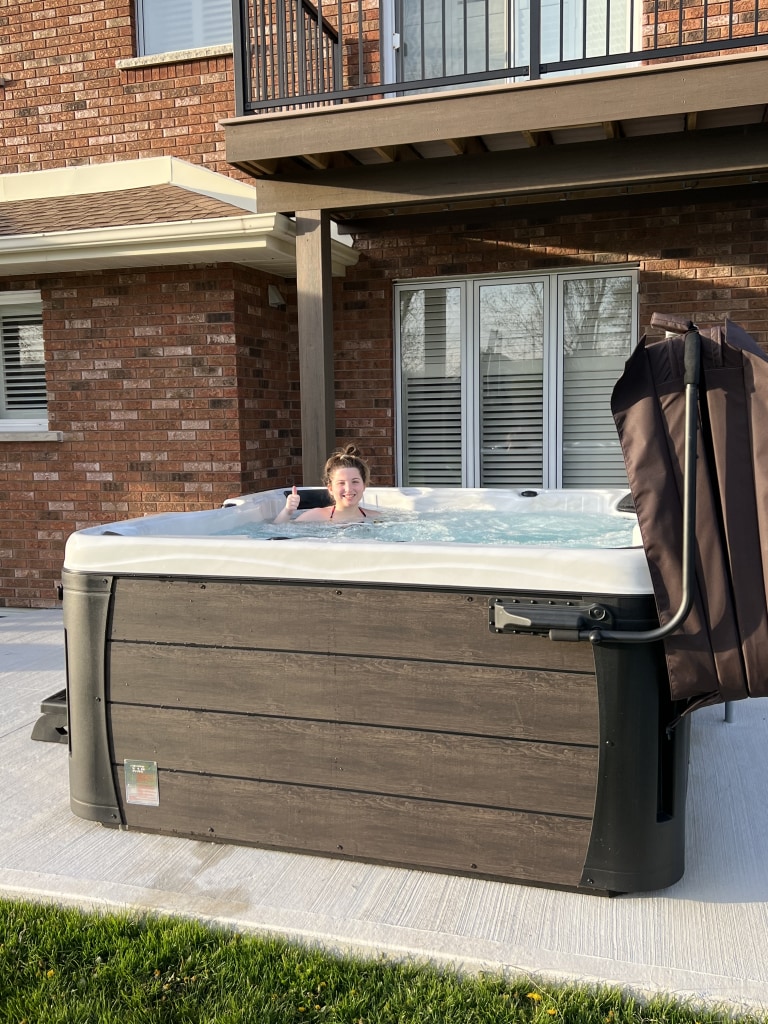 Giving a thumbs up while relaxing in spa