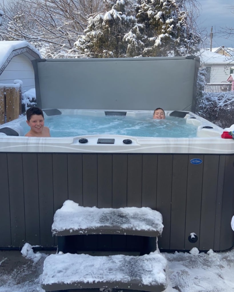 Boys spending time in the spa during the winter
