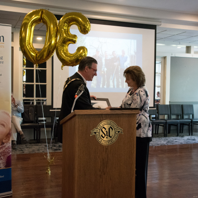 Chair Caslin Presents 30th Anniversary Plaque to Lori Beech