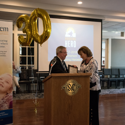 Jim Bradley Presents 30th Anniversary Plaque to Lori Beech
